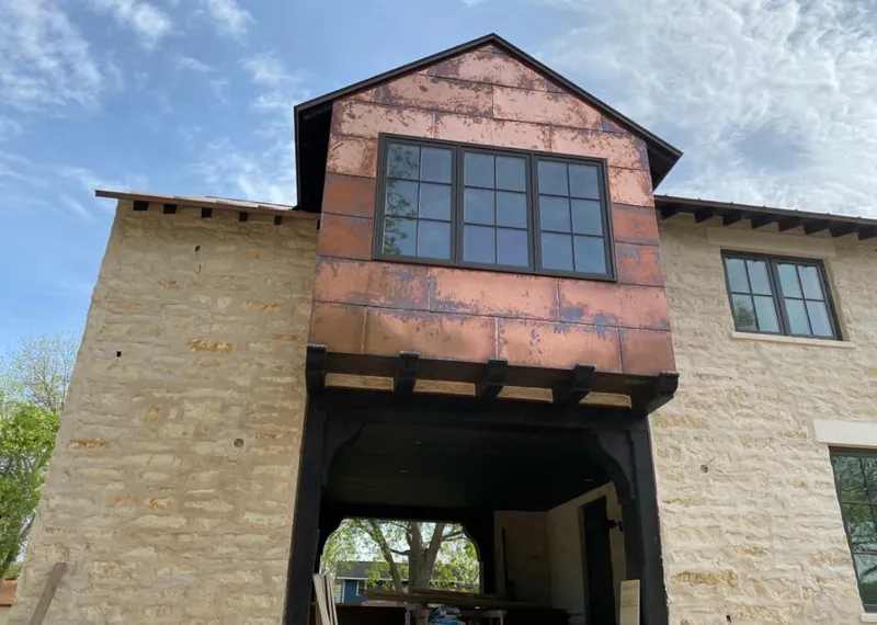 Copper metal panel facade on a stone building for Metal Roof Coating in Port Clinton