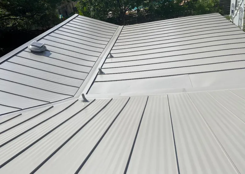 Solar attic fan installed on a metal roof for Roof Ventilation in Port Clinton